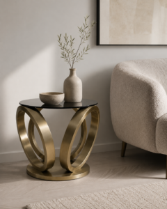 Luxury round side table featuring a smooth black tinted glass top resting on an architectural base of intersecting brushed brass rings over a circular metal platform.